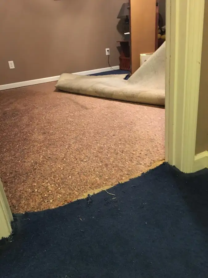 Carpet pad removal revealing water damage during Water Mitigation Services in Rocklin
